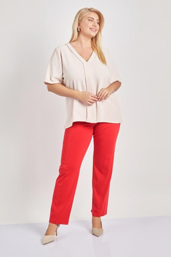 Ελαστικό παντελόνι με διακοσμητικά κουμπιά